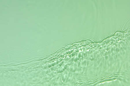green transparent clear water surface texture summer backgroundの写真素材