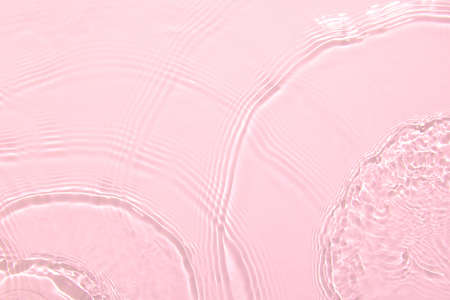 pink transparent clear water surface texture summer backgroundの写真素材