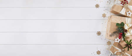 Christmas banner with border of gift boxes on white wood backgroundの写真素材