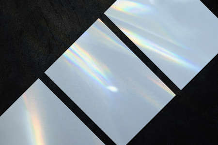 Three empty vertical rectangle poster mockup on dark backgroundの写真素材