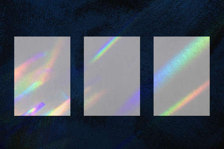 Three empty vertical rectangle poster mockup on dark blue background