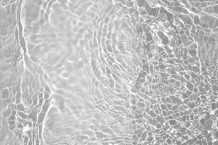 desaturated transparent clear calm water surface textureの写真素材