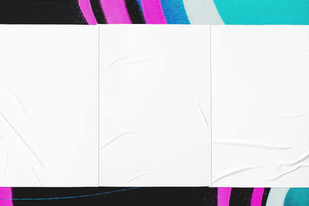 colorful urban wall texture with three wrinkled glued poster templates