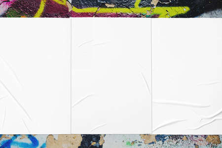 colorful urban wall texture with three wrinkled glued poster templates