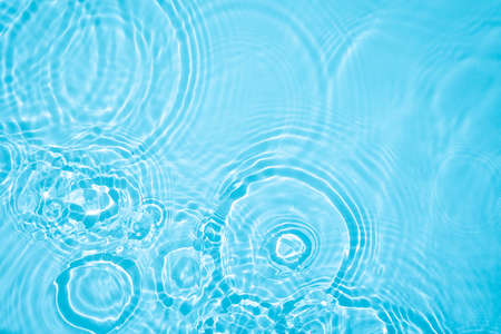 transparent blue colored clear calm water surface texture