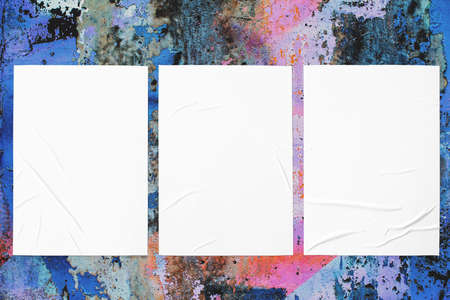 colorful urban wall texture with three wrinkled glued poster templates