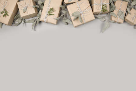 Small gift boxes on solid gray backgroundの写真素材