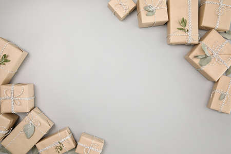 Small gift boxes on solid gray backgroundの写真素材