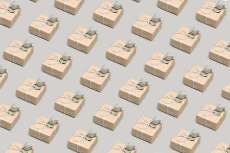 Pattern made of gift boxes on solid gray backgroundの写真素材
