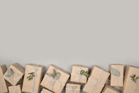 Small gift boxes on solid gray backgroundの写真素材