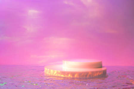 empty scene with cylinder podiums on holographic pink backgroundの写真素材