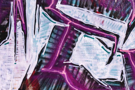 close up of colorful messy painted urban wall texture