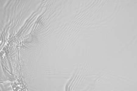 desaturated transparent clear calm water surface textureの写真素材