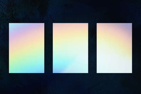 Three empty vertical rectangle poster mockup on dark backgroundの写真素材