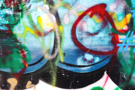 close up of colorful messy painted urban wall textureの写真素材