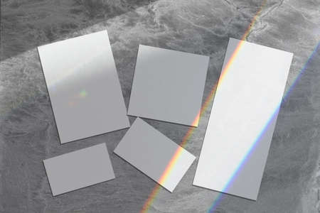 Empty wedding stationery mockups with shadows on gray background