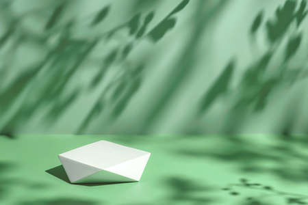 scene with polygonal podium on mint background and shadowsの写真素材