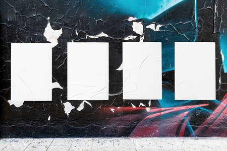 urban street wall and four wrinkled glued poster templatesの写真素材