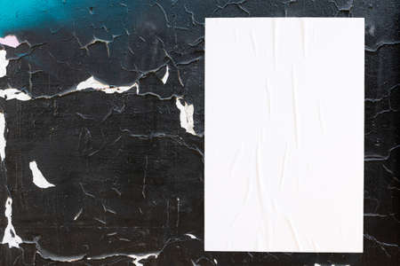 colorful urban wall texture with wrinkled glued poster templateの写真素材