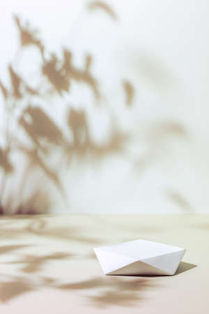 scene with polygonal podium on beige background and shadowsの写真素材
