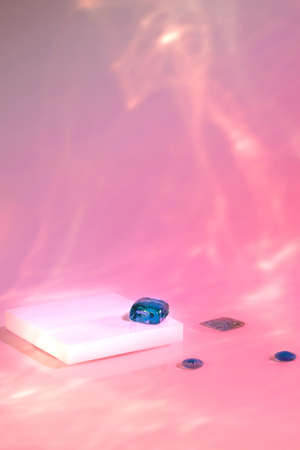 empty scene with square podium on holographic pink backgroundの写真素材