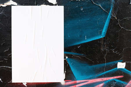 colorful urban wall texture with wrinkled glued poster templateの写真素材