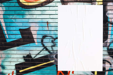 colorful urban wall texture with wrinkled glued poster templateの写真素材