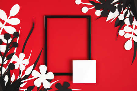 black frame on red and white paper cut leavesの写真素材