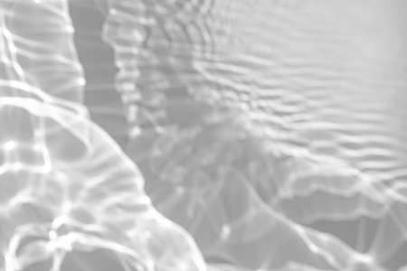 blurred shadow and light caustic effect on a white wall