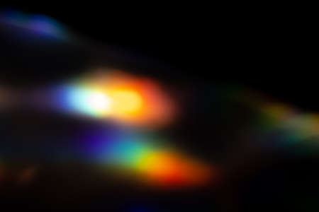 colorful rainbow crystal light leaks on black background