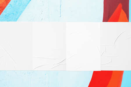 colorful urban wall texture with four wrinkled glued poster templates