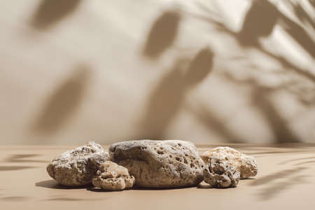 scene with composition of stones on beige background
