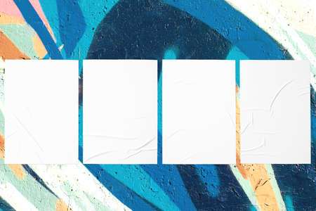 teal mint urban wall with four glued postersの写真素材