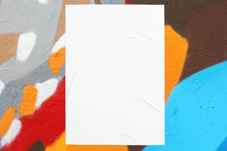 colorful urban wall texture with two wrinkled glued poster template