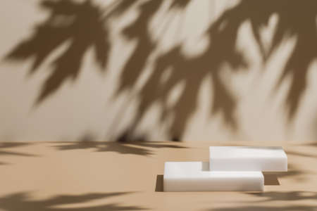 scene with white podium on beige background and shadowsの写真素材