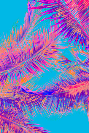 neon pink and purple colored palms on mint backgroundの写真素材