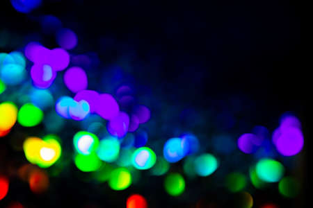 Purple and green circles bokeh festive glitter dark background
