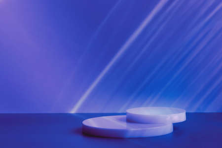 empty podiums on blue background with light caustic effectの写真素材