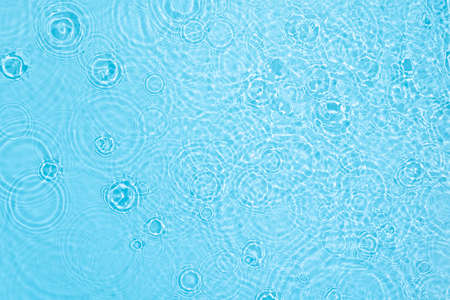 transparent blue colored clear calm water surface texture