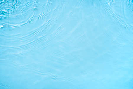 transparent blue colored clear calm water surface texture