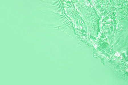 transparent green colored clear calm water surface texture