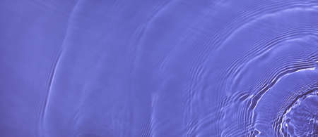 banner transparent purple colored clear calm water surface textureの写真素材