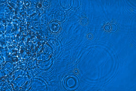 transparent dark blue colored clear calm water surface texture