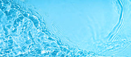 transparent blue clear calm water surface wave textureの写真素材