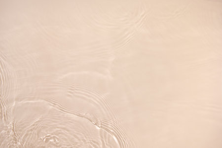 transparent beige colored clear calm water surface texture