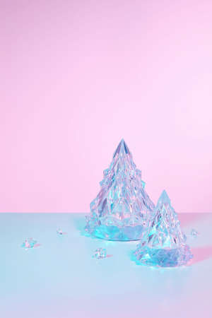 Winter scene with Christmas decorations on holographic pink backgroundの写真素材