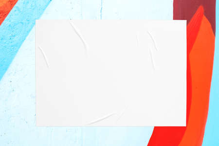 colorful urban wall texture with wrinkled glued poster templateの写真素材