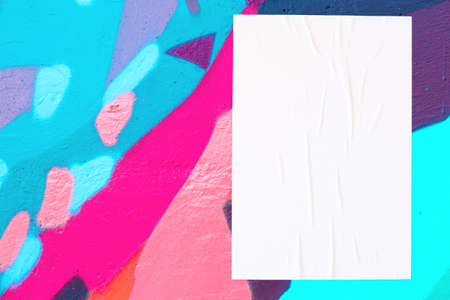 colorful urban wall with wrinkled glued poster templateの写真素材