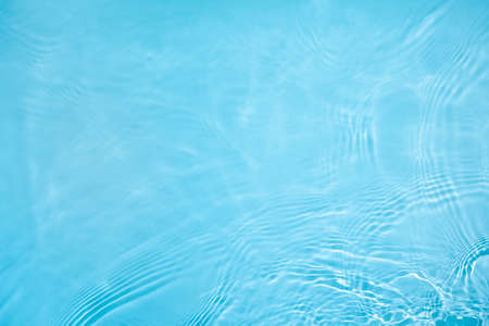 transparent blue clear calm wave water surface textureの写真素材