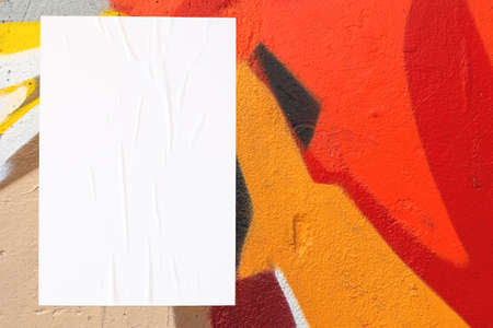 colorful urban wall texture with wrinkled glued poster templateの写真素材